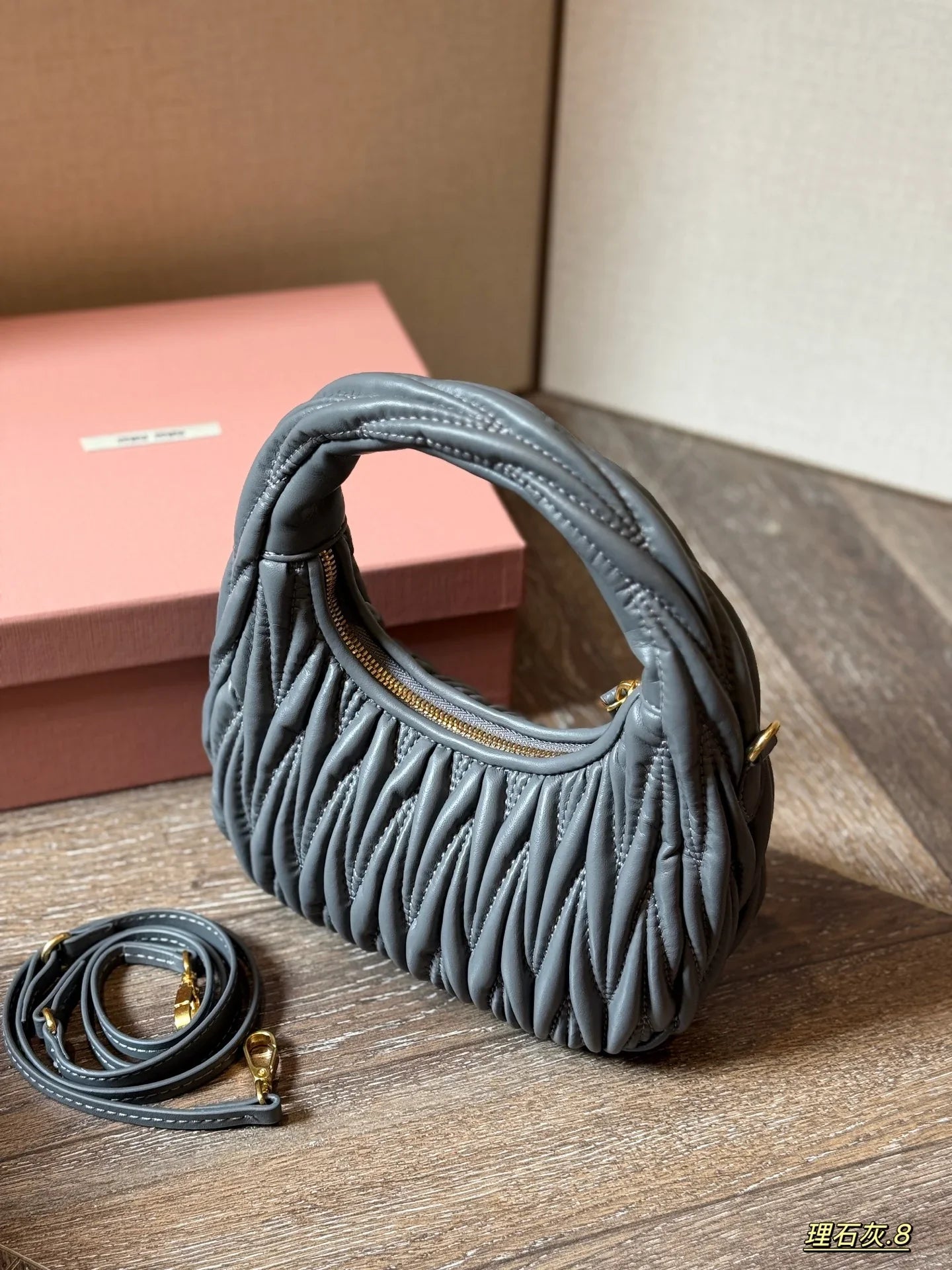 Wrist bag with wrinkled crescent shape