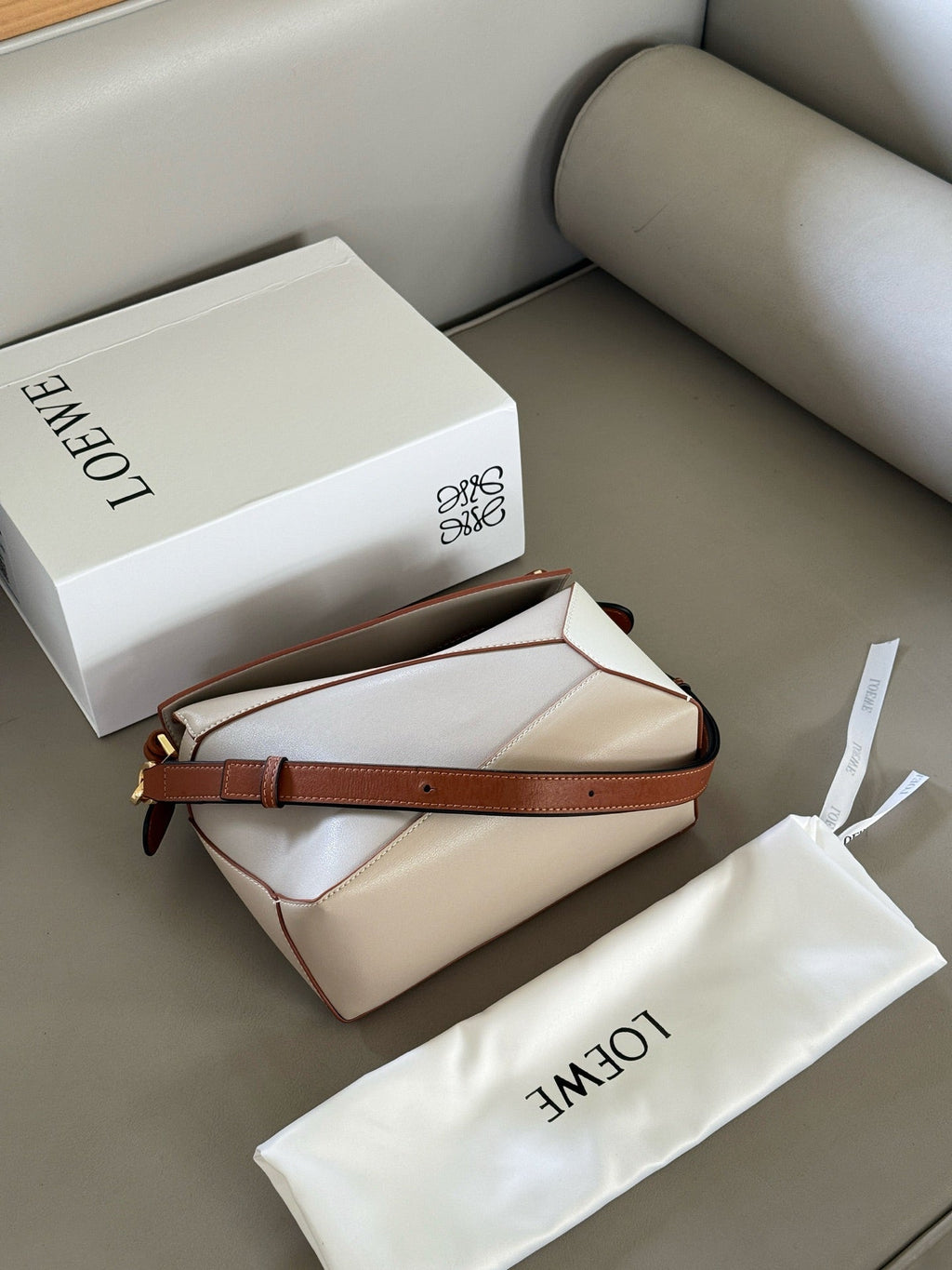 Woven handle, color blocked geometric bag, cowhide