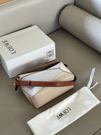 Woven handle, color blocked geometric bag, cowhide