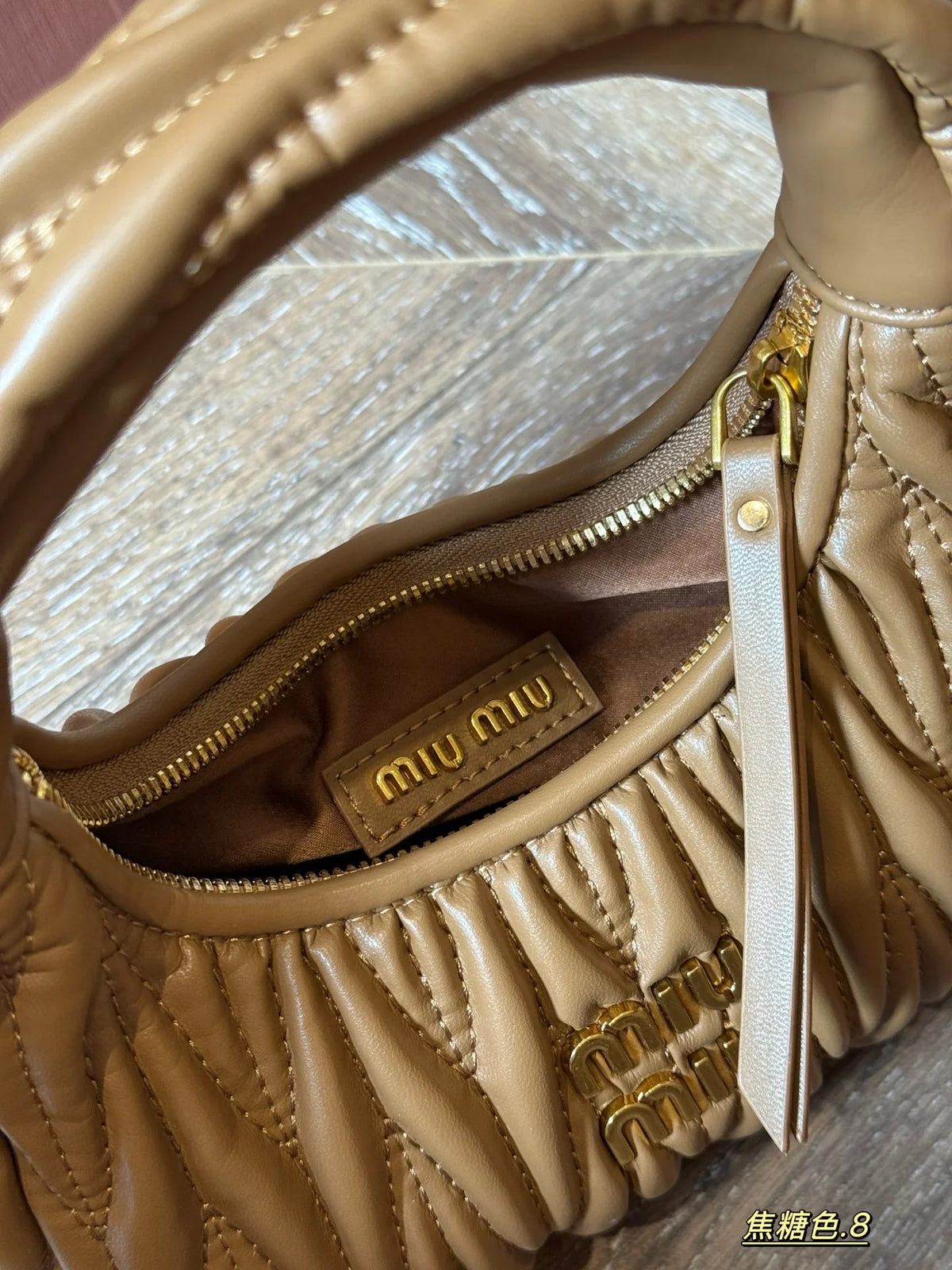 Wrist bag with wrinkled crescent shape