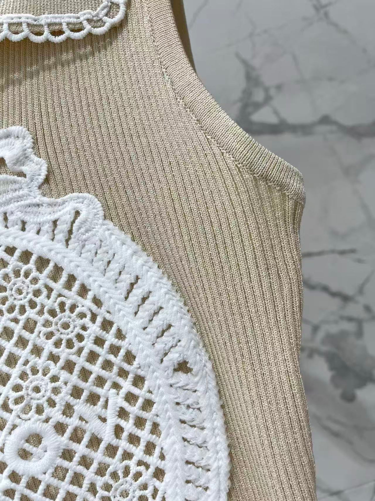 Open-knit vest with a Peter Pan collar