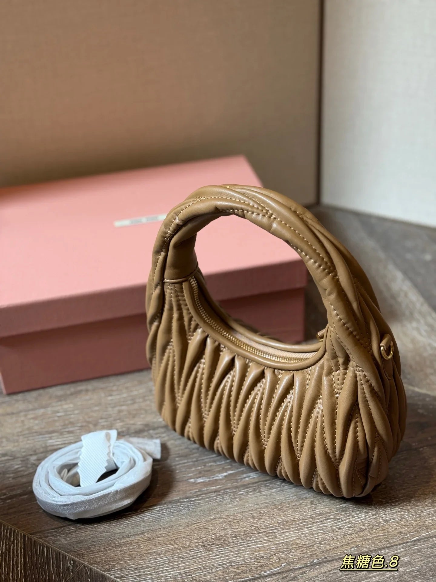 Wrist bag with wrinkled crescent shape