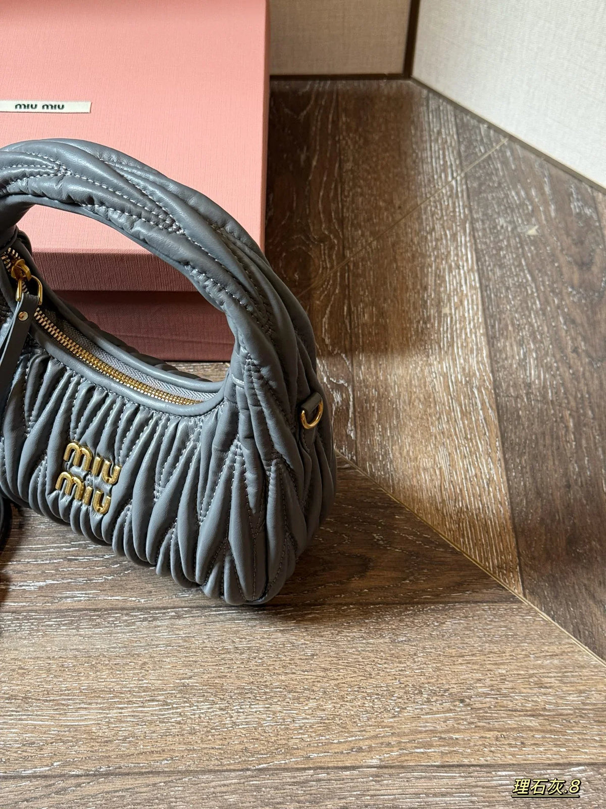Wrist bag with wrinkled crescent shape