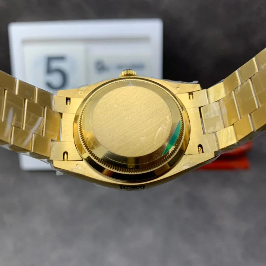 Yellow gold - Green dial - Automatic - 36mm