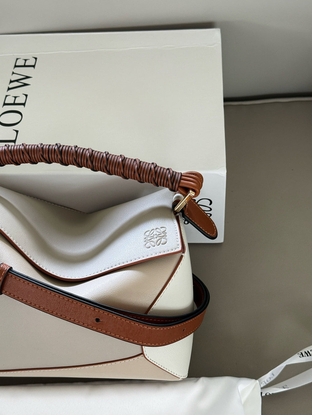 Woven handle, color blocked geometric bag, cowhide