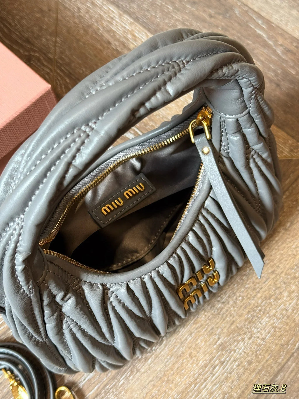 Wrist bag with wrinkled crescent shape