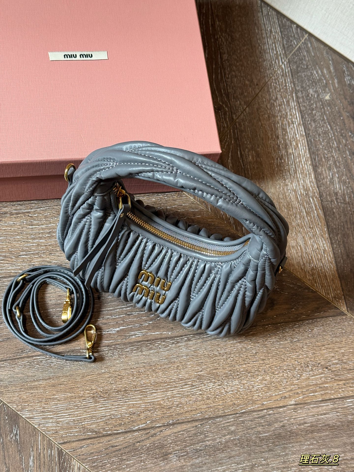 Wrist bag with wrinkled crescent shape