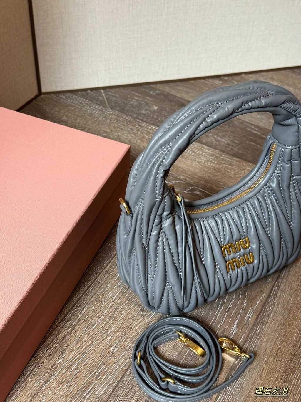 Wrist bag with wrinkled crescent shape