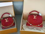 Wrist bag with wrinkled crescent shape