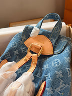 Blue denim double pocket triangular buckle backpack