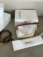 Woven handle, color blocked geometric bag, cowhide
