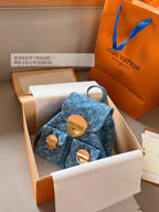 Blue denim double pocket triangular buckle backpack