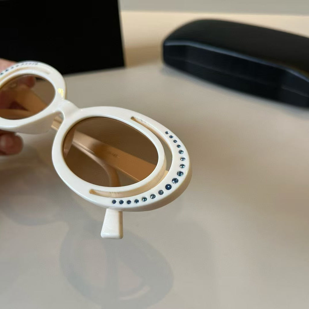 Explosive elliptical sunglasses