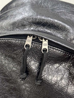 Oil cured leather backpack